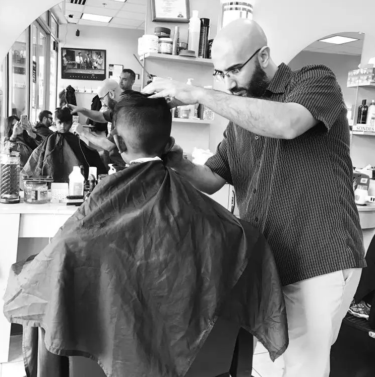 Khalid's Barber Shop logo