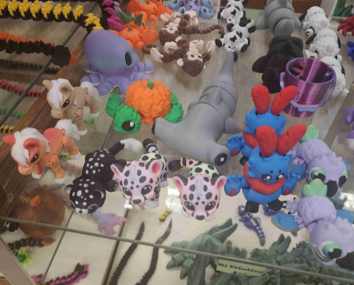 Slip into the magical world of 3D Printing! It will whisk you away on an amazing journey with dragons & creature galore! cover photo collage