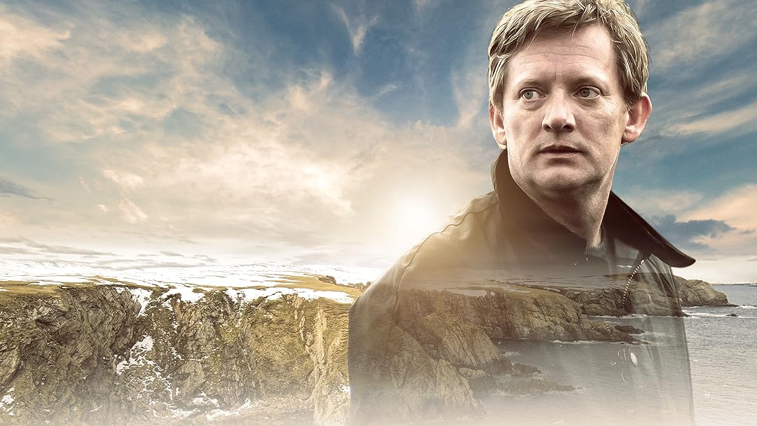 Official series image for the cozy crime series Shetland featuring DI Jimmy Perez standing on a rugged coastal cliff in Scotland.