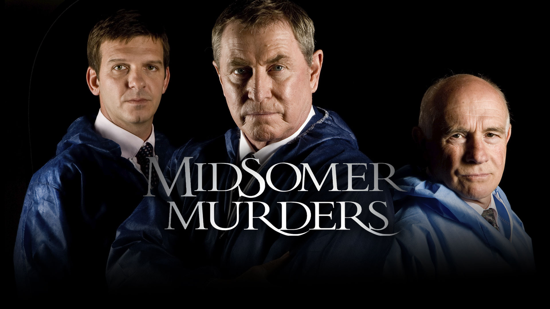 DCI John Barnaby and DS Jamie Winter standing in the picturesque but deadly English countryside from Midsomer Murders.