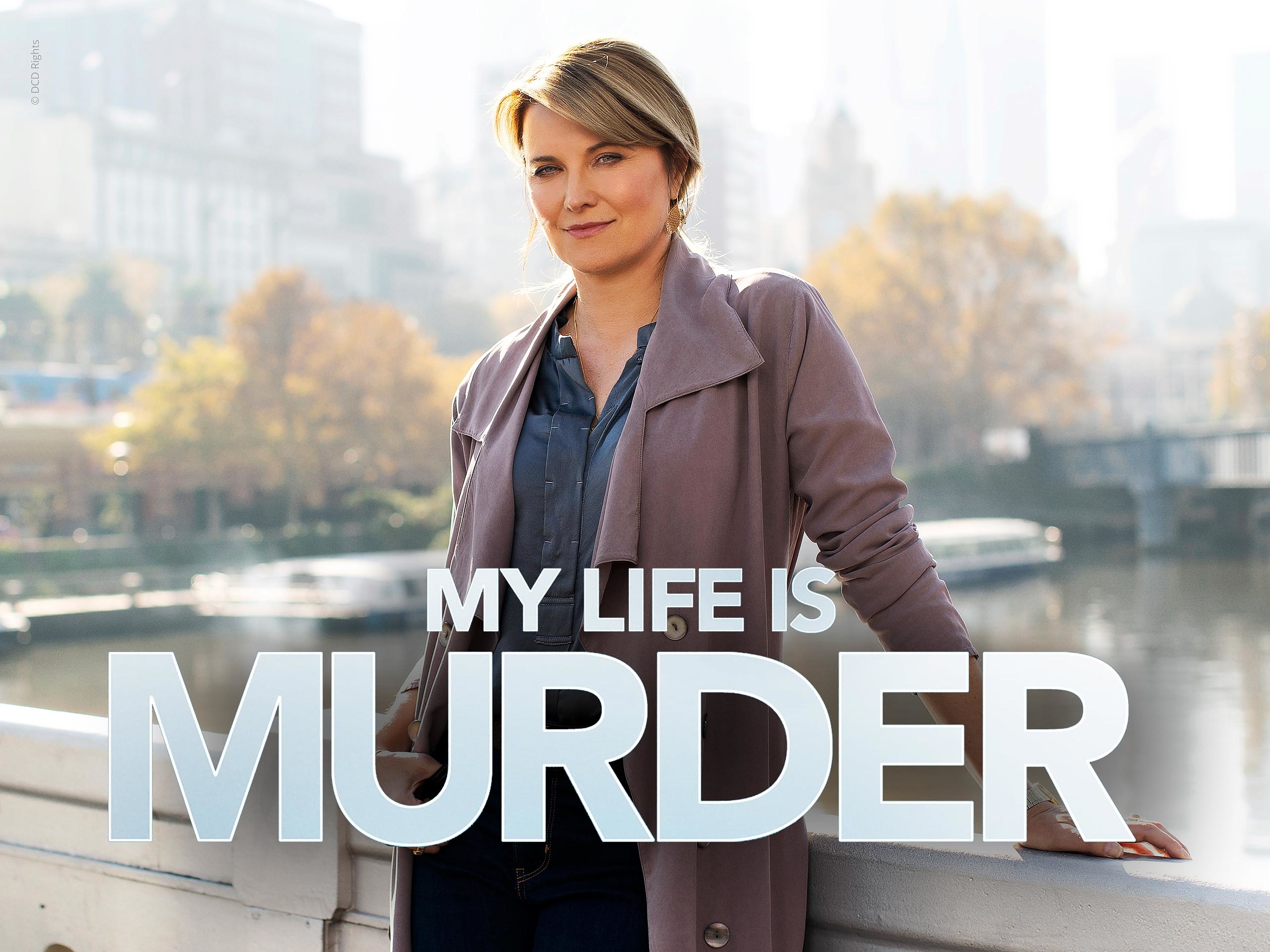 Alexa Crowe from My Life is Murder looking sharp and stylish with her characteristic dark hair, set against a vibrant city backdrop.