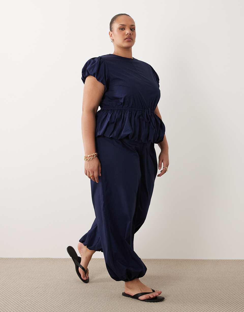 ASOS DESIGN Curve Jumpsuit with Peplum and Balloon Legs in Navy